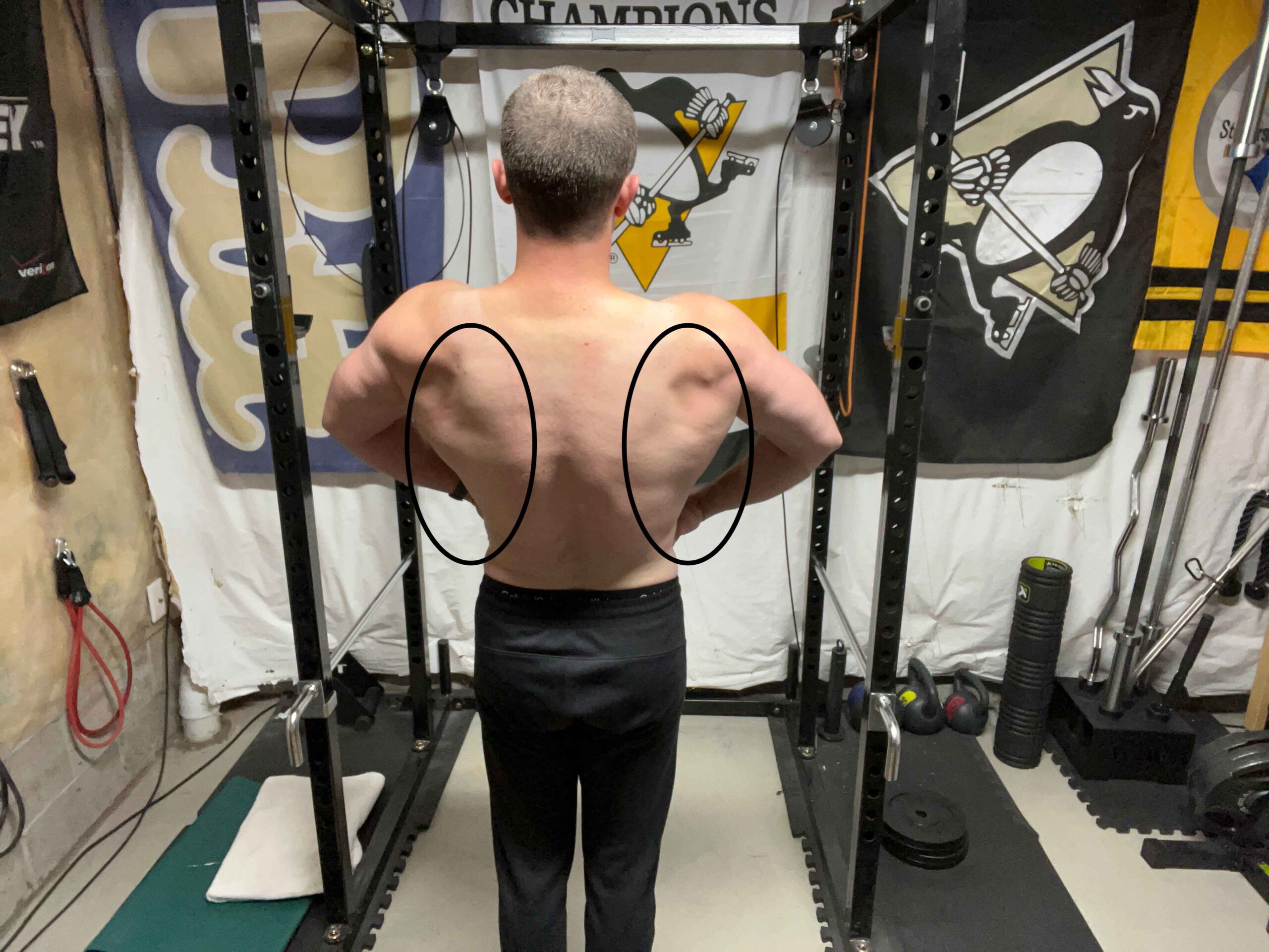 Person posing and flexing the lat muscles