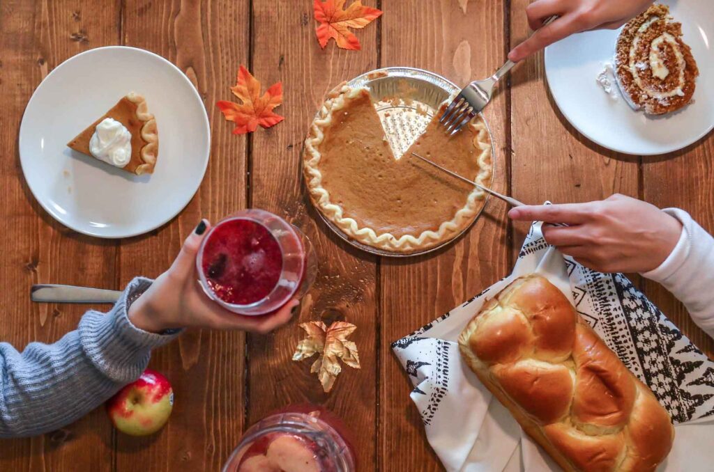 Pumpkin Pie and Drinks on a table, How to Avoid Weight Gain Over Thanksgiving